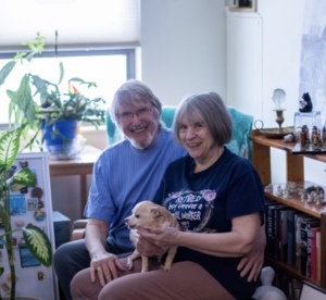 Warren Paris (left) and Jerri MacConnell (right) pose for a portrait with their dog, Ginger, at their Iowa City apartment on Feb 8, 2021